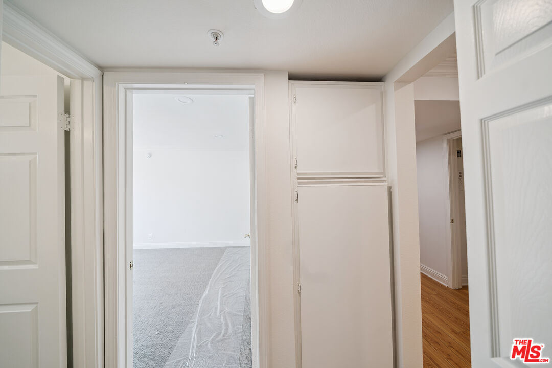 1508 Greenfield Avenue, Unit 206 Los Angeles, CA 90025 - Photo 16 of 31 a view of a hallway with closet area
