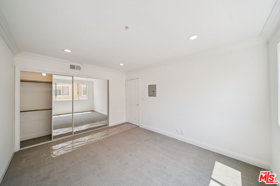 1508 Greenfield Avenue, Unit 206 Los Angeles, CA 90025 - Photo 18 of 31 a view of an empty room with a kitchen