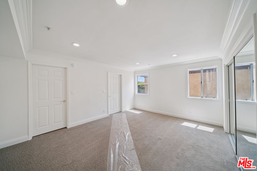 1508 Greenfield Avenue, Unit 206 Los Angeles, CA 90025 - Photo 23 of 31 a view of an empty room with a window