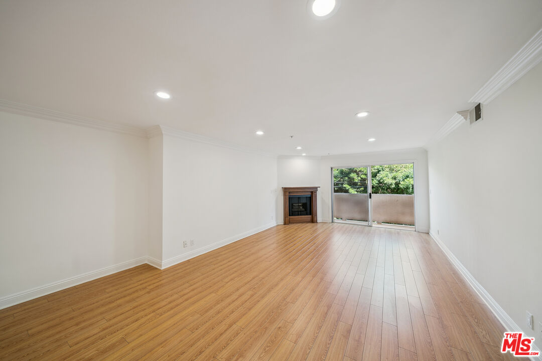 1508 Greenfield Avenue, Unit 206 Los Angeles, CA 90025 - Photo 3 of 31 a view of a livingroom with wooden floor