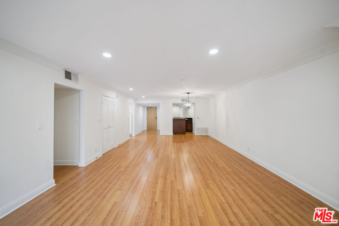 1508 Greenfield Avenue, Unit 206 Los Angeles, CA 90025 - Photo 5 of 31 a view of empty room with wooden floor