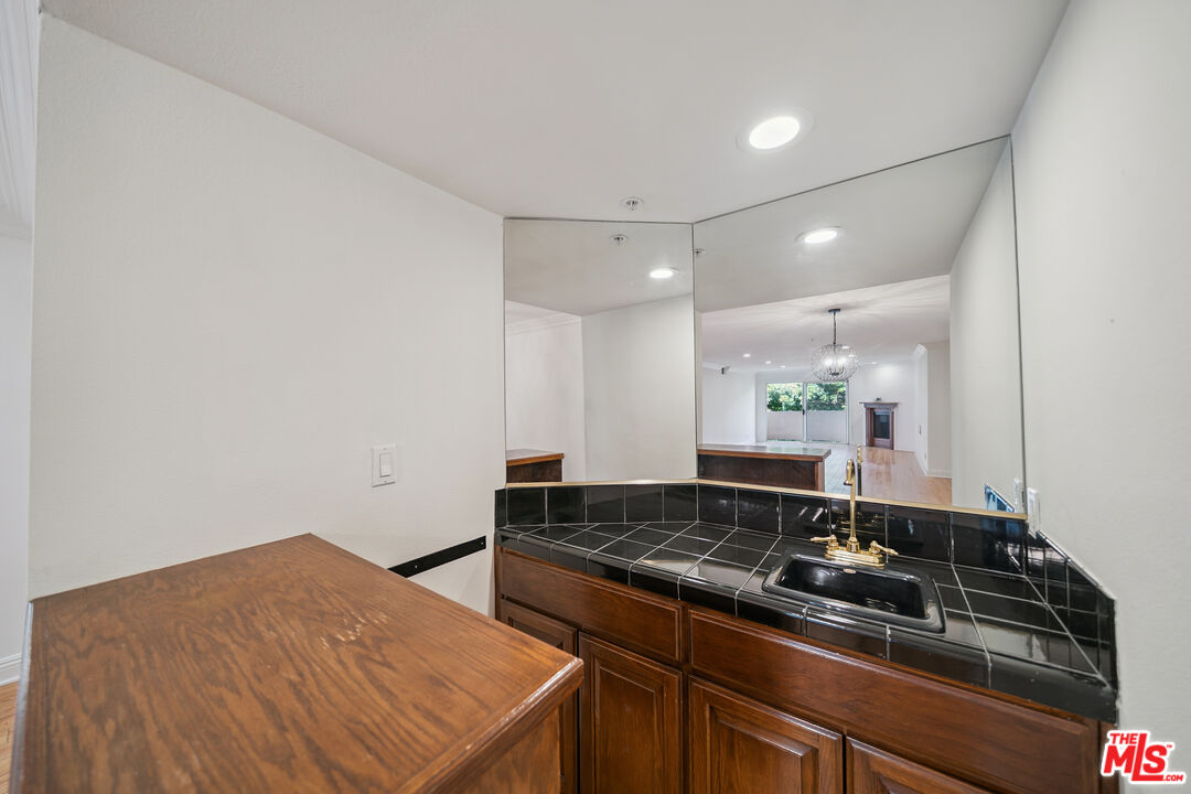 1508 Greenfield Avenue, Unit 206 Los Angeles, CA 90025 - Photo 7 of 31 a kitchen with a sink and stove