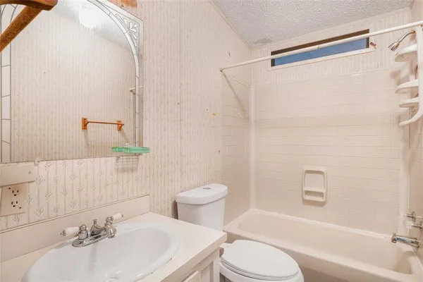 an empty room with a windows and cabinet