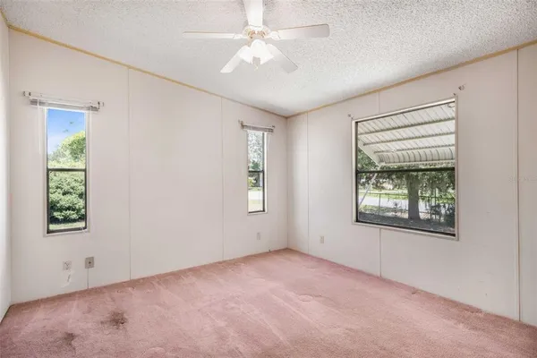 a bathroom with a granite countertop sink a toilet and a bathtub
