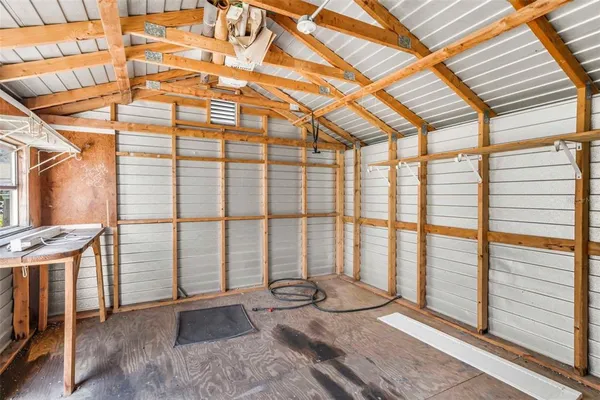 a view of a porch with a table and chairs