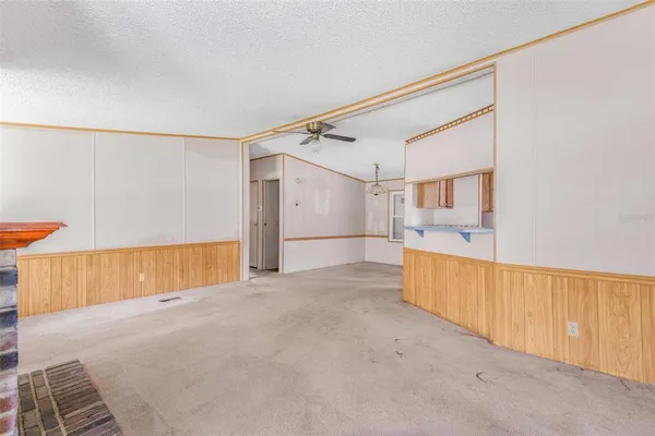 a view of an empty room with a cabinet