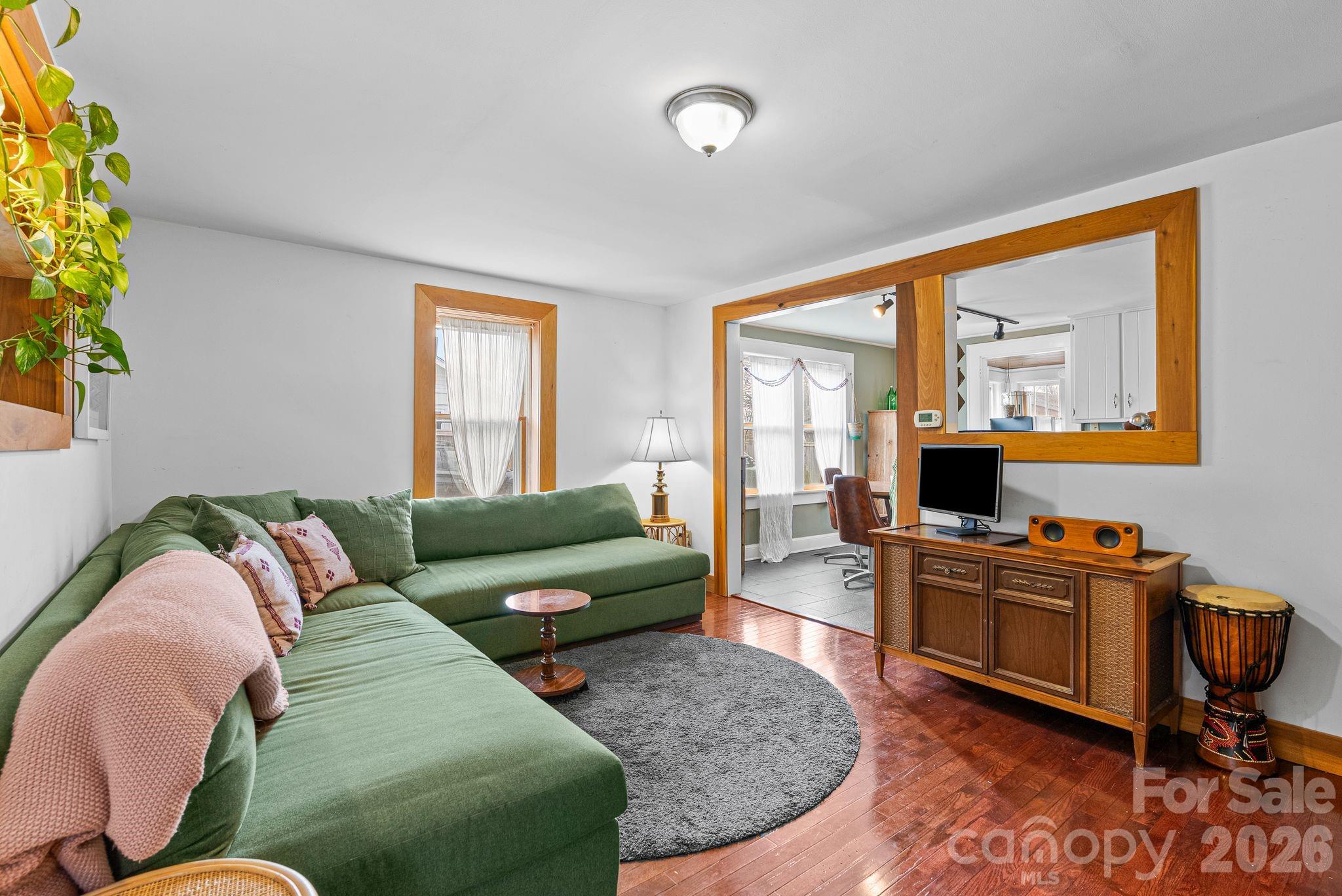 271 Pisgah View Road Asheville, NC 28806 - Photo 11 of 40 a living room with furniture and a large window