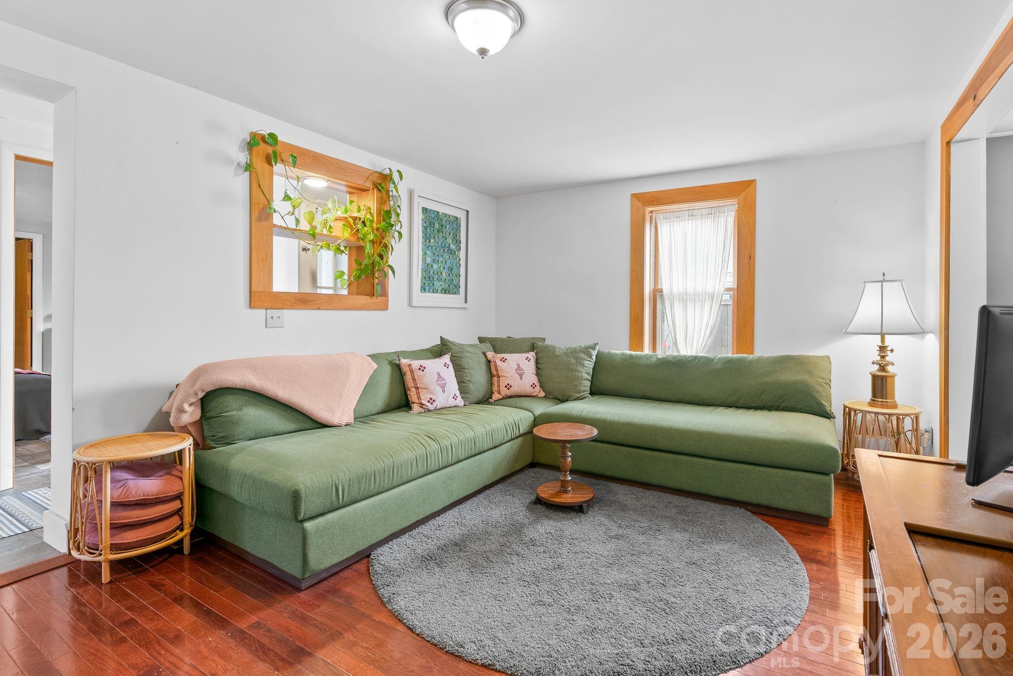 271 Pisgah View Road Asheville, NC 28806 - Photo 12 of 40 a living room with furniture and a wooden floor