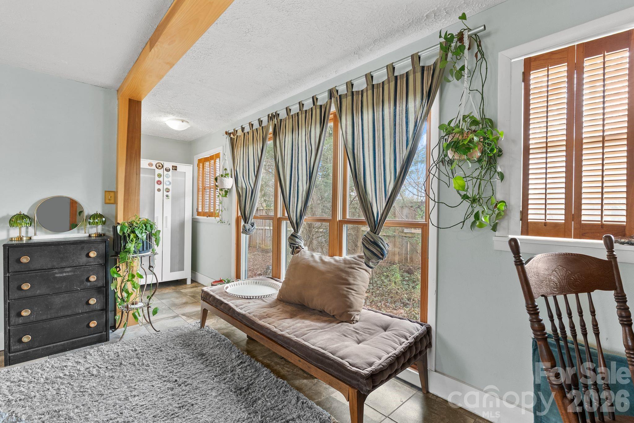 271 Pisgah View Road Asheville, NC 28806 - Photo 15 of 40 a living room with furniture and a window