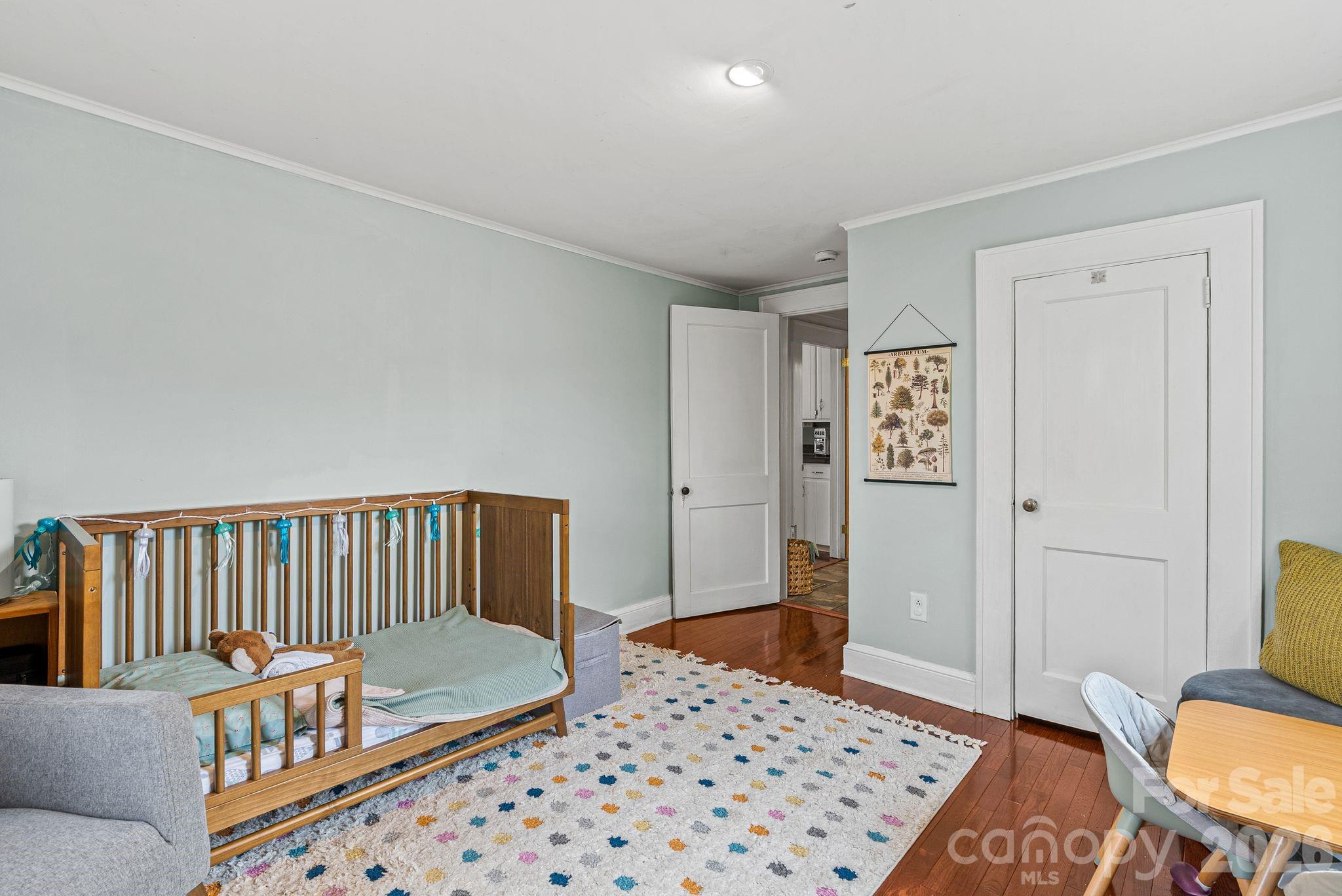 271 Pisgah View Road Asheville, NC 28806 - Photo 22 of 40 a bedroom with furniture and a window