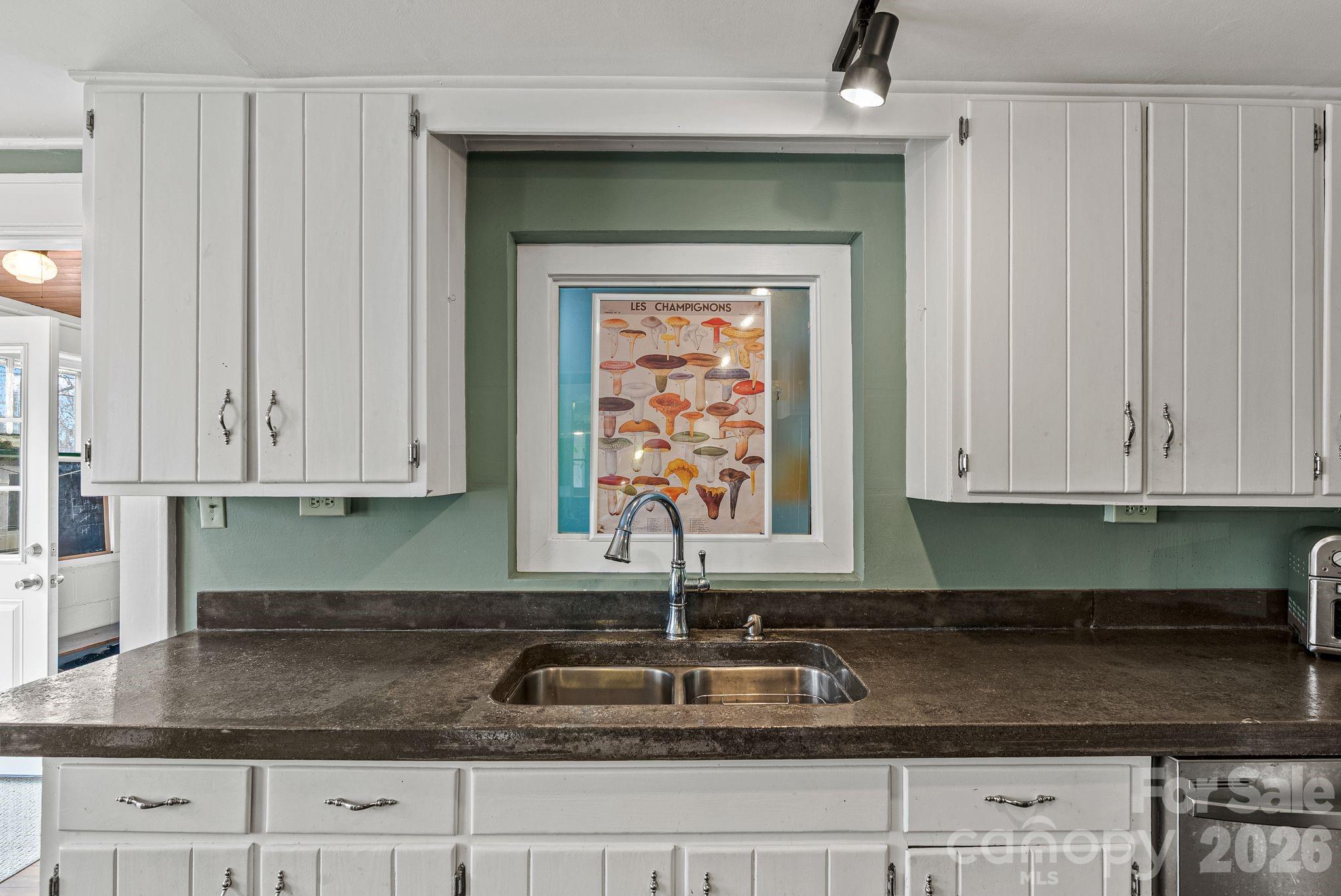 271 Pisgah View Road Asheville, NC 28806 - Photo 5 of 40 a kitchen with granite countertop white cabinets and a sink