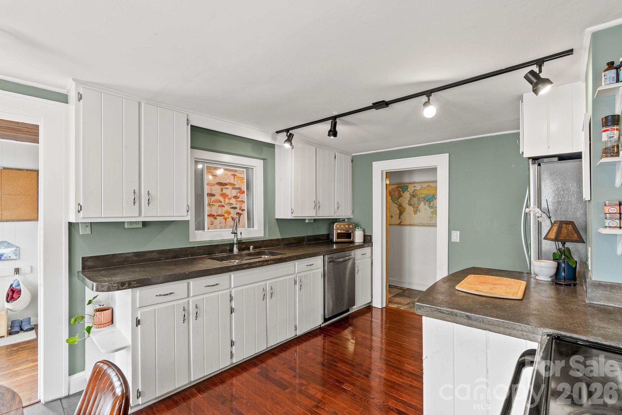 271 Pisgah View Road Asheville, NC 28806 - Photo 8 of 40 a kitchen with sink cabinets and window