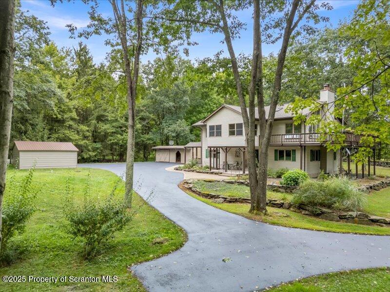 1777 Highway 2002 Nicholson, PA 18446 - Photo 2 of 52 a front view of a house with garden