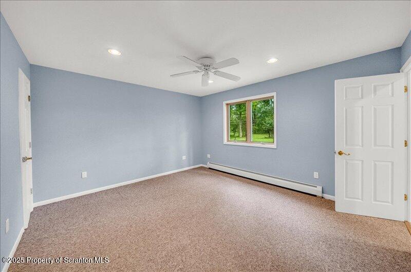 1777 Highway 2002 Nicholson, PA 18446 - Photo 23 of 52 an empty room with windows and fan