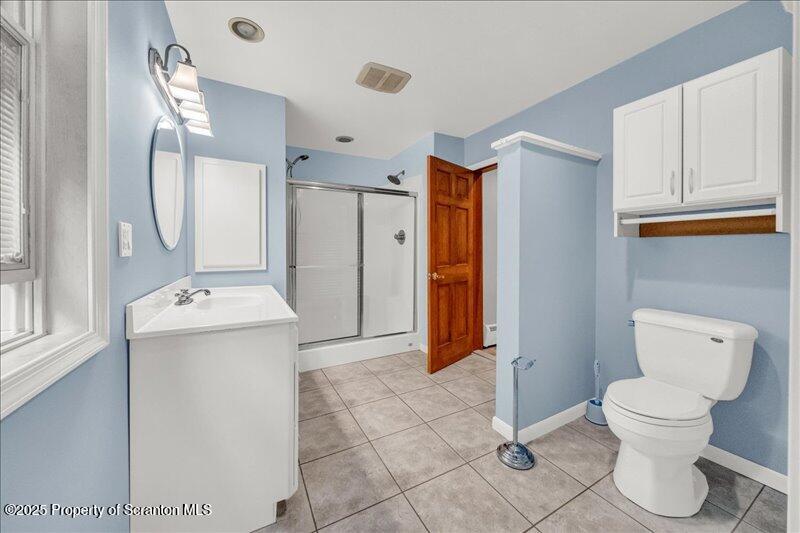 1777 Highway 2002 Nicholson, PA 18446 - Photo 24 of 52 a bathroom with a sink a toilet and shower