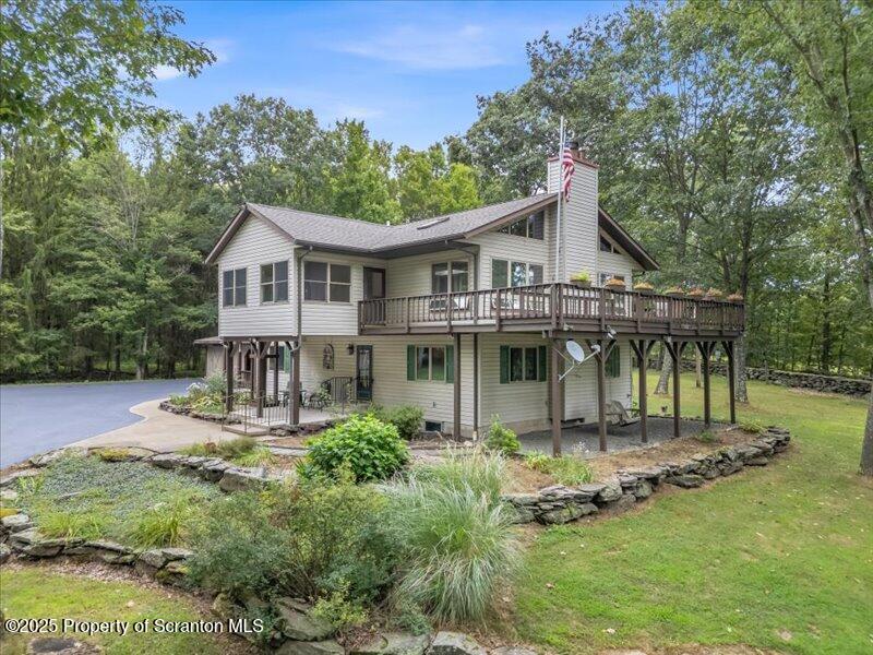 1777 Highway 2002 Nicholson, PA 18446 - Photo 3 of 52 a front view of a house with a yard table and chairs