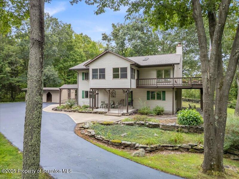 1777 Highway 2002 Nicholson, PA 18446 - Photo 52 of 52 a front view of a house with a yard table and chairs