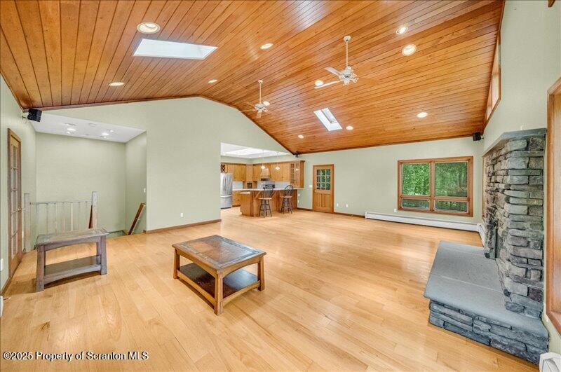 1777 Highway 2002 Nicholson, PA 18446 - Photo 8 of 52 a living room with a couch and a table with wooden floor