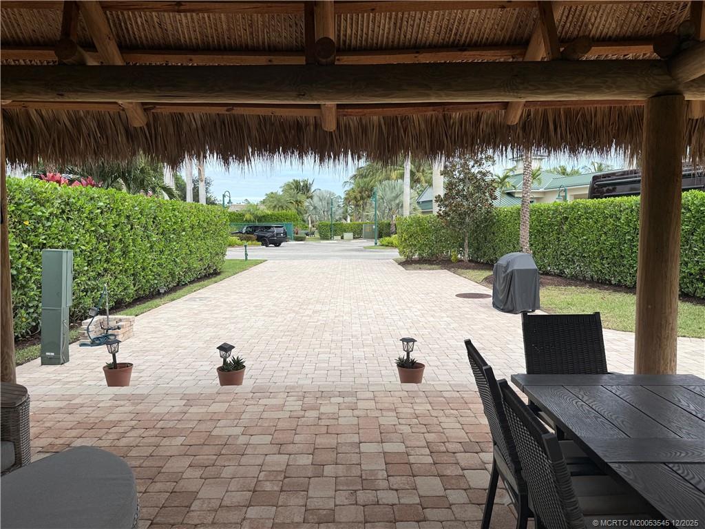 11075 West Indiantown Road, Unit 6 Jupiter, FL 33478 - Photo 6 of 14 a view of backyard with swimming pool and outdoor seating