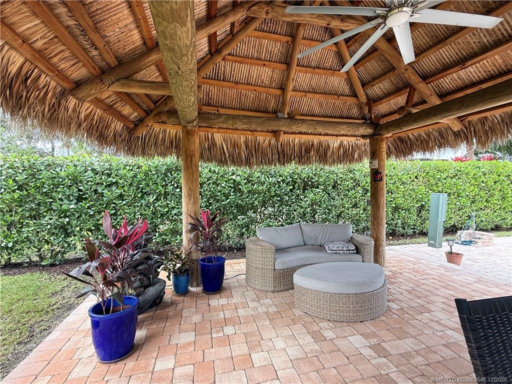 11075 West Indiantown Road, Unit 6 Jupiter, FL 33478 - Photo 8 of 14 a view of a patio with table and chairs potted plants