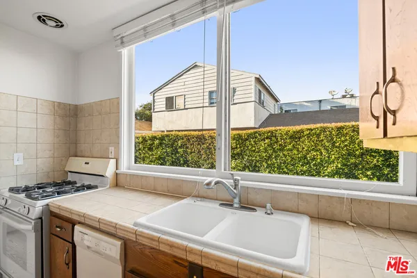 a kitchen with a sink and a window