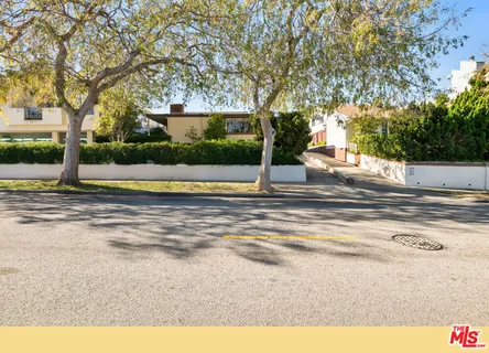 a view of pool and trees in the background