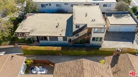 an aerial view of a house with swimming pool