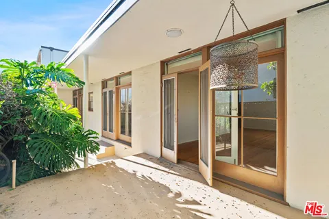 a view of a glass door with a glass door and a window