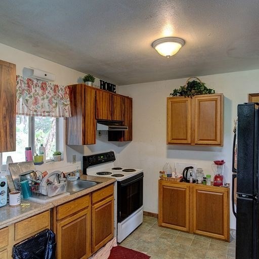 136 A Hoaka Road Hilo, HI 96720 - Photo 8 of 10 a kitchen with stainless steel appliances granite countertop a stove and a sink