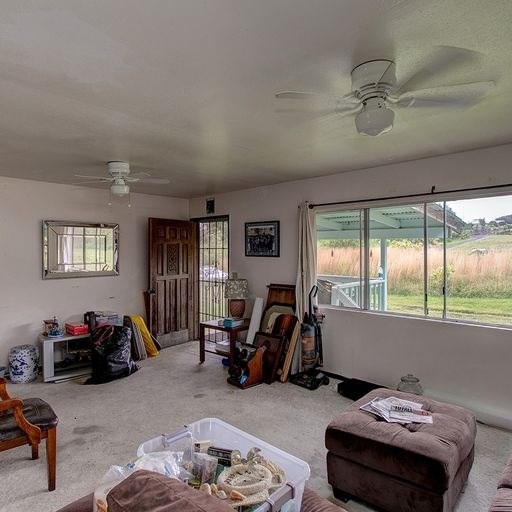 136 A Hoaka Road Hilo, HI 96720 - Photo 9 of 10 a living room with furniture a window and gym equipment