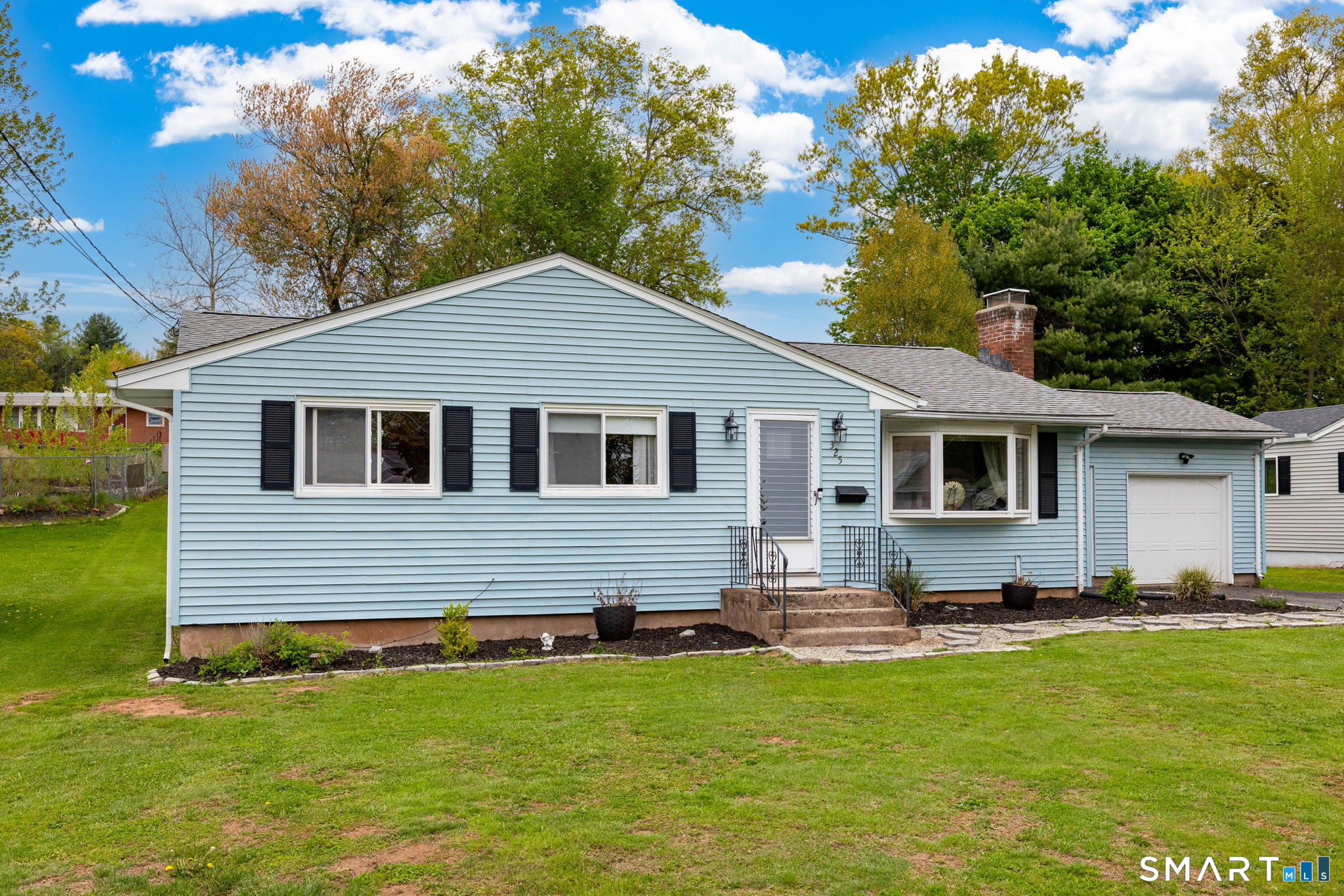325 Barbara Road Middletown, CT 06457 - Photo 23 of 40 a front view of a house with a yard