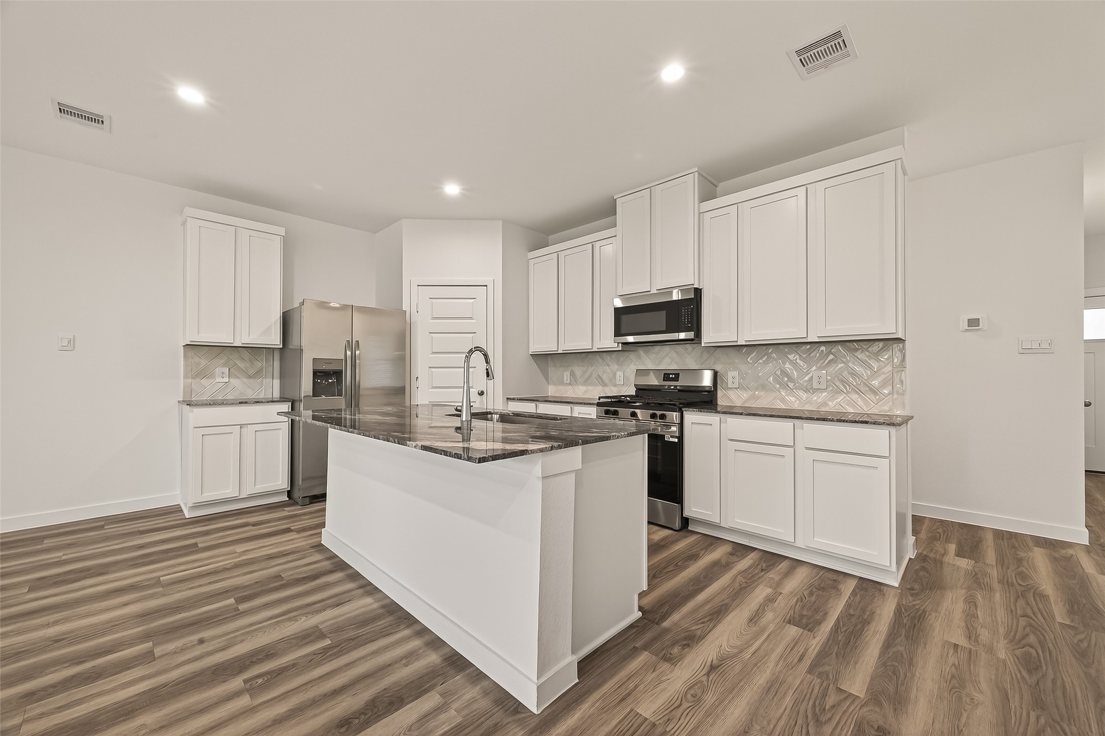 2826 Lisburn Ter Lane Houston, TX 77051 - Photo 3 of 18 a kitchen with refrigerator and cabinets