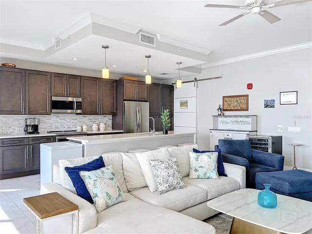 a kitchen with stainless steel appliances a refrigerator sink and cabinets