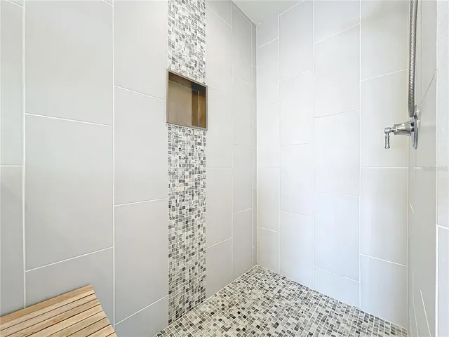 view of living room with large windows and a rug