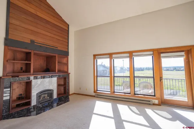 a view of livingroom with furniture and fireplace