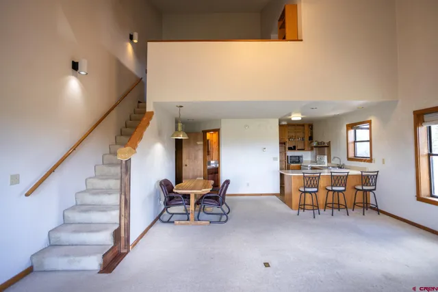a view of a livingroom with furniture and lounge chair