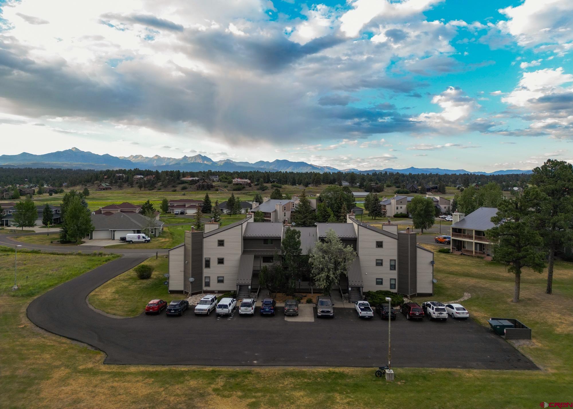 164 Valley View Drive, Unit 3218 Pagosa Springs, CO 81147 - Photo 2 of 39 a view of a house with a yard