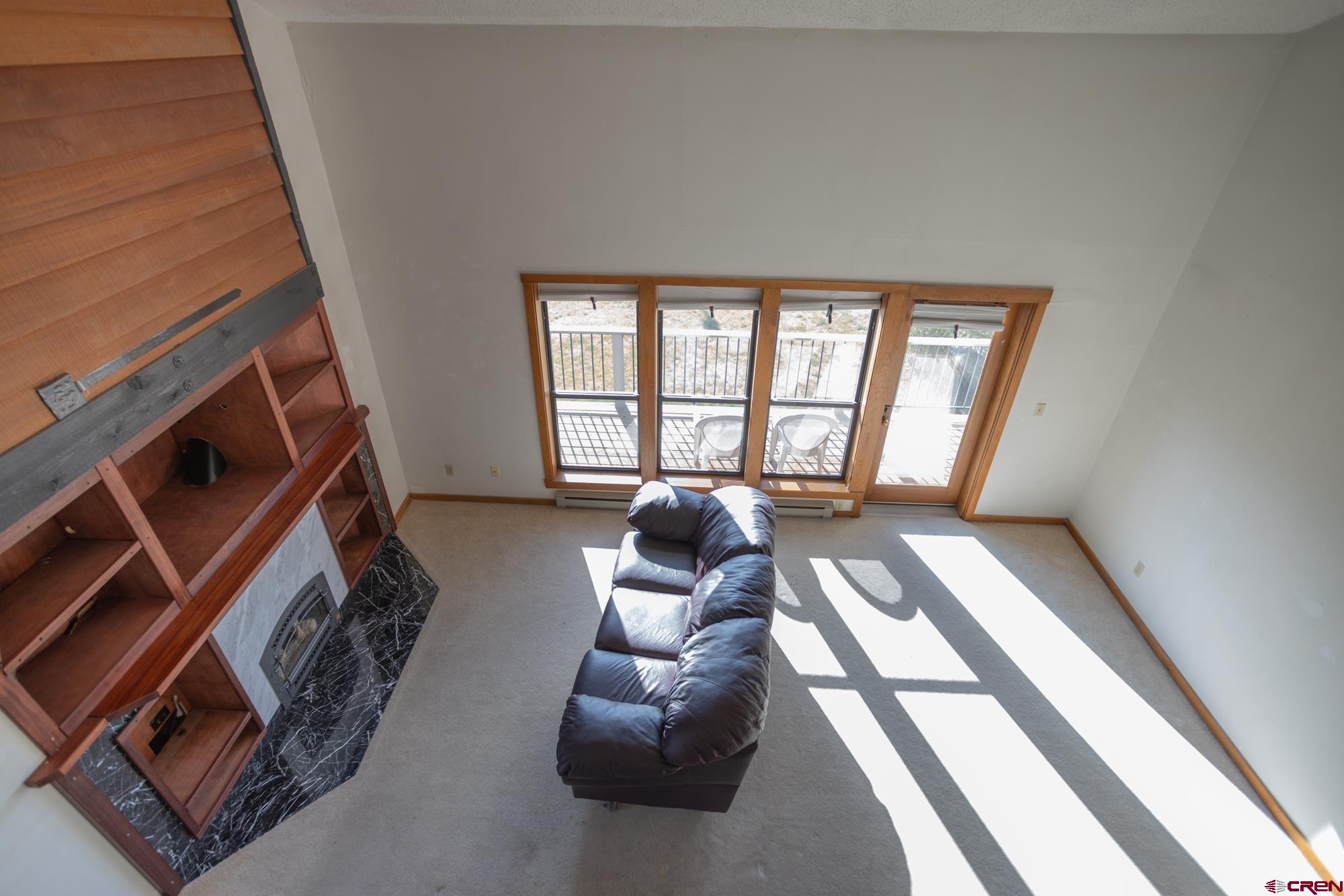 164 Valley View Drive, Unit 3218 Pagosa Springs, CO 81147 - Photo 21 of 39 a living room with furniture and a fireplace