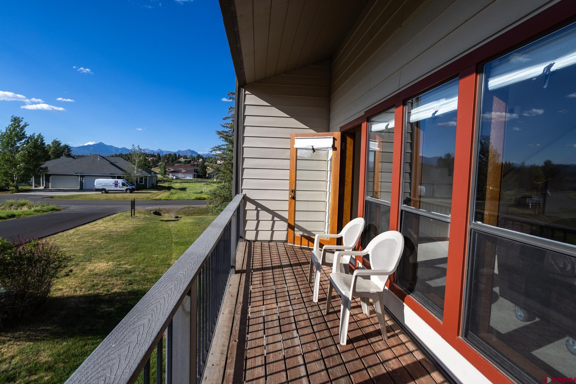 164 Valley View Drive, Unit 3218 Pagosa Springs, CO 81147 - Photo 28 of 39 a balcony with table and chairs