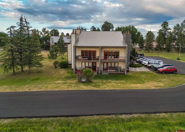 a view of a house with a yard