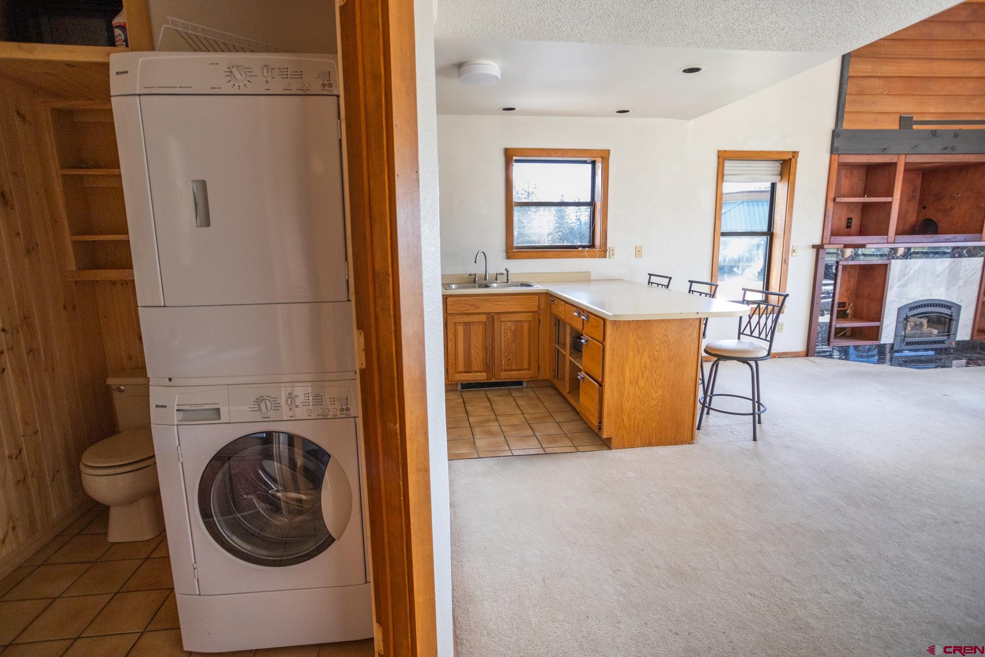 164 Valley View Drive, Unit 3218 Pagosa Springs, CO 81147 - Photo 4 of 39 a view of a bedroom with washer and dryer