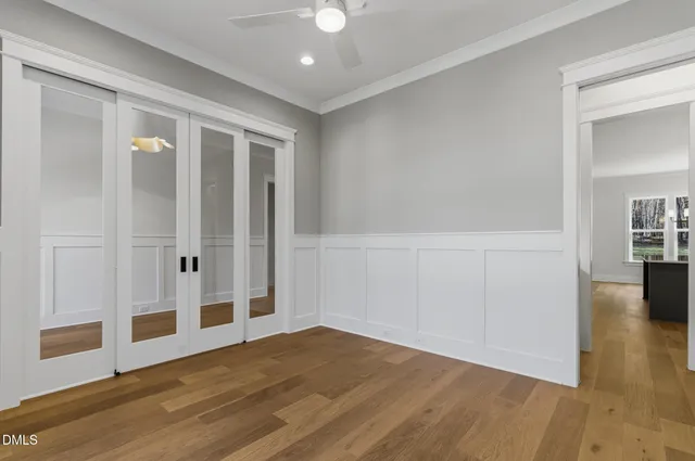 a large kitchen with kitchen island a sink stainless steel appliances and cabinets