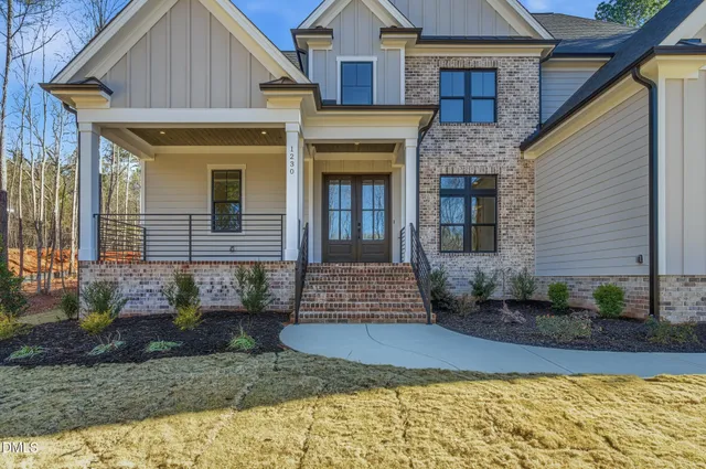 a view of a house with a backyard