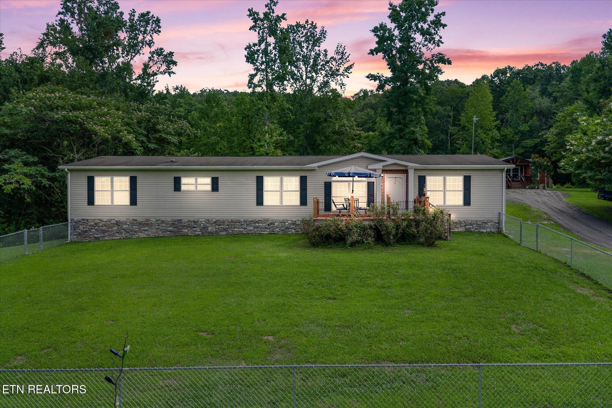 20292025 Shiloh Road Decatur, TN 37322 - Photo 4 of 60 a front view of a house with a garden