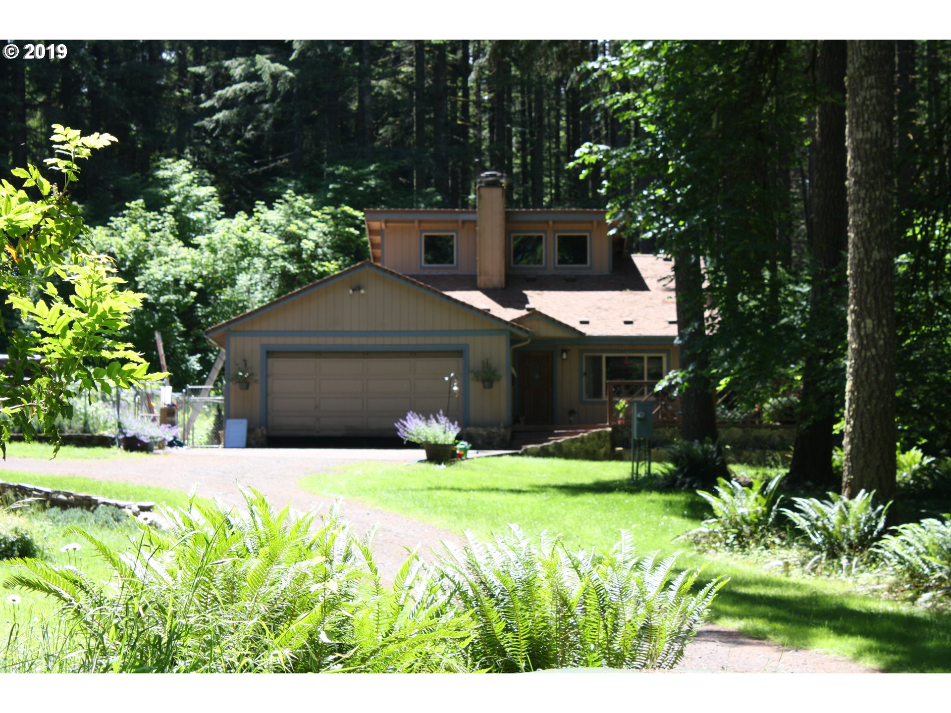 37754 Wallace Creek Road Springfield, OR 97478 - Photo 1 of 23 a house view with a garden space