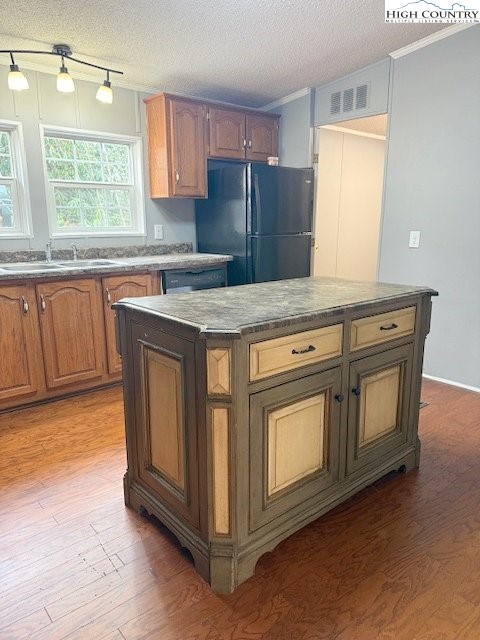 68 Rhoneys View Road Newland, NC 28657 - Photo 14 of 37 a kitchen with granite countertop a stove a sink and dishwasher with wooden floor