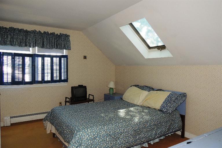 23 Shore Rd Extension West Harwich, MA 02671 - Photo 11 of 24 a bedroom with a bed and window