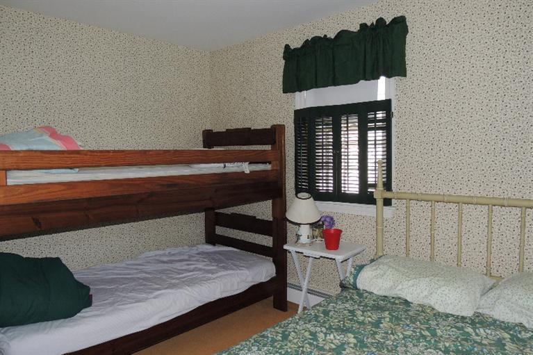 23 Shore Rd Extension West Harwich, MA 02671 - Photo 14 of 24 a bedroom with a bed and a window