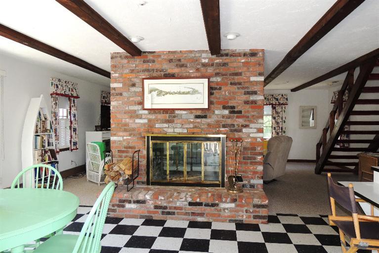 23 Shore Rd Extension West Harwich, MA 02671 - Photo 6 of 24 a living room with furniture and a fireplace
