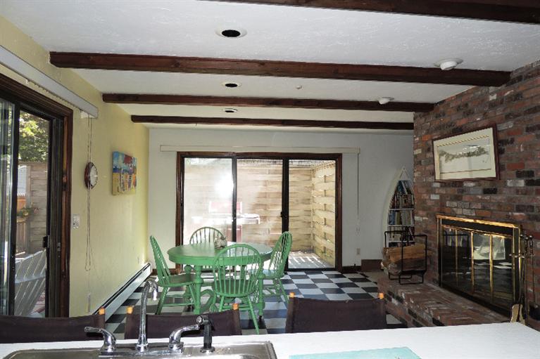 23 Shore Rd Extension West Harwich, MA 02671 - Photo 7 of 24 a living room with fireplace furniture and a flat screen tv